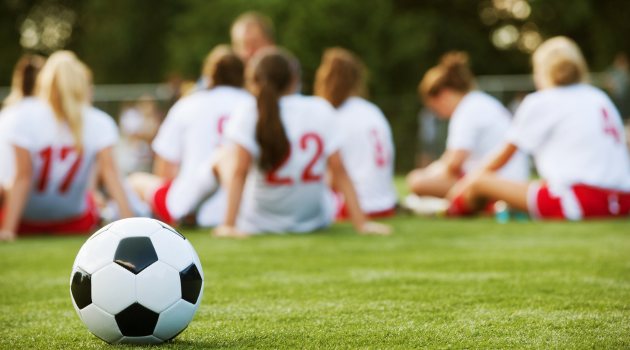 Cleveland Flames youth soccer players celebrating together on the field in Cleveland, Tennessee